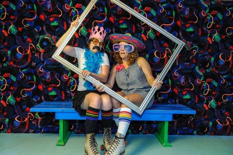 Black rainbow striped under-the-knee socks for bold LGBTQ+ expression