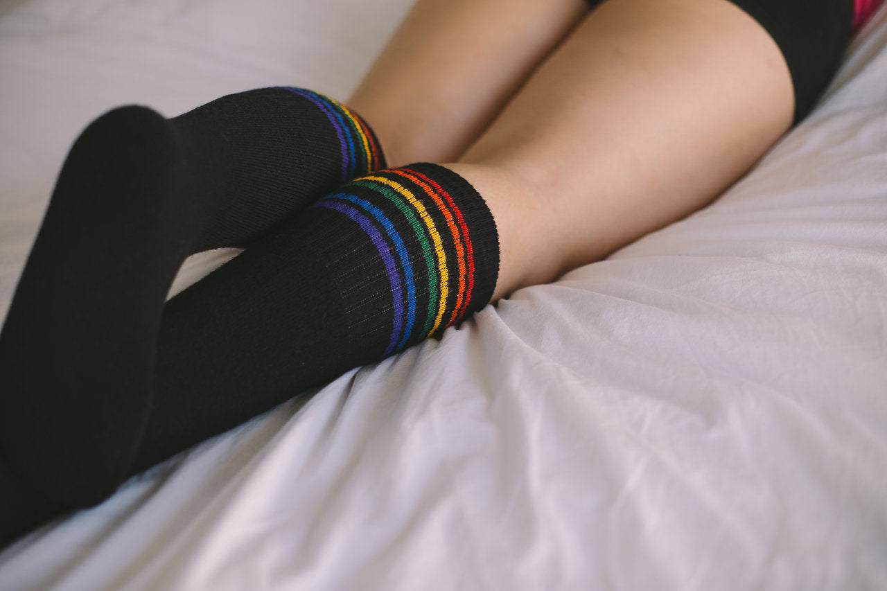 no matter where you hang out, your black rainbow striped retro pride socks will always keep you company.