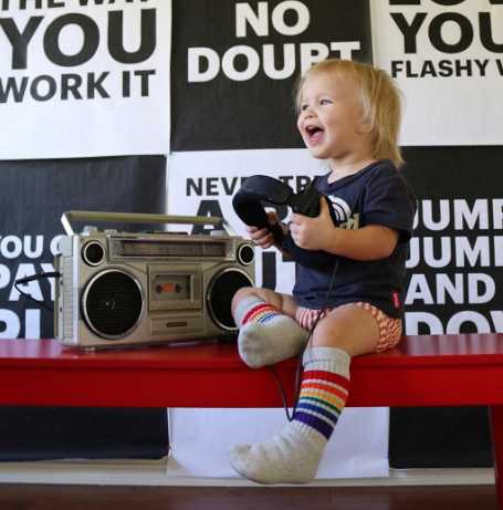 Toddler dressed in rainbow socks and matching playful outfit