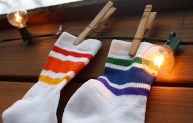 showing off your mismatch rainbow pride socks