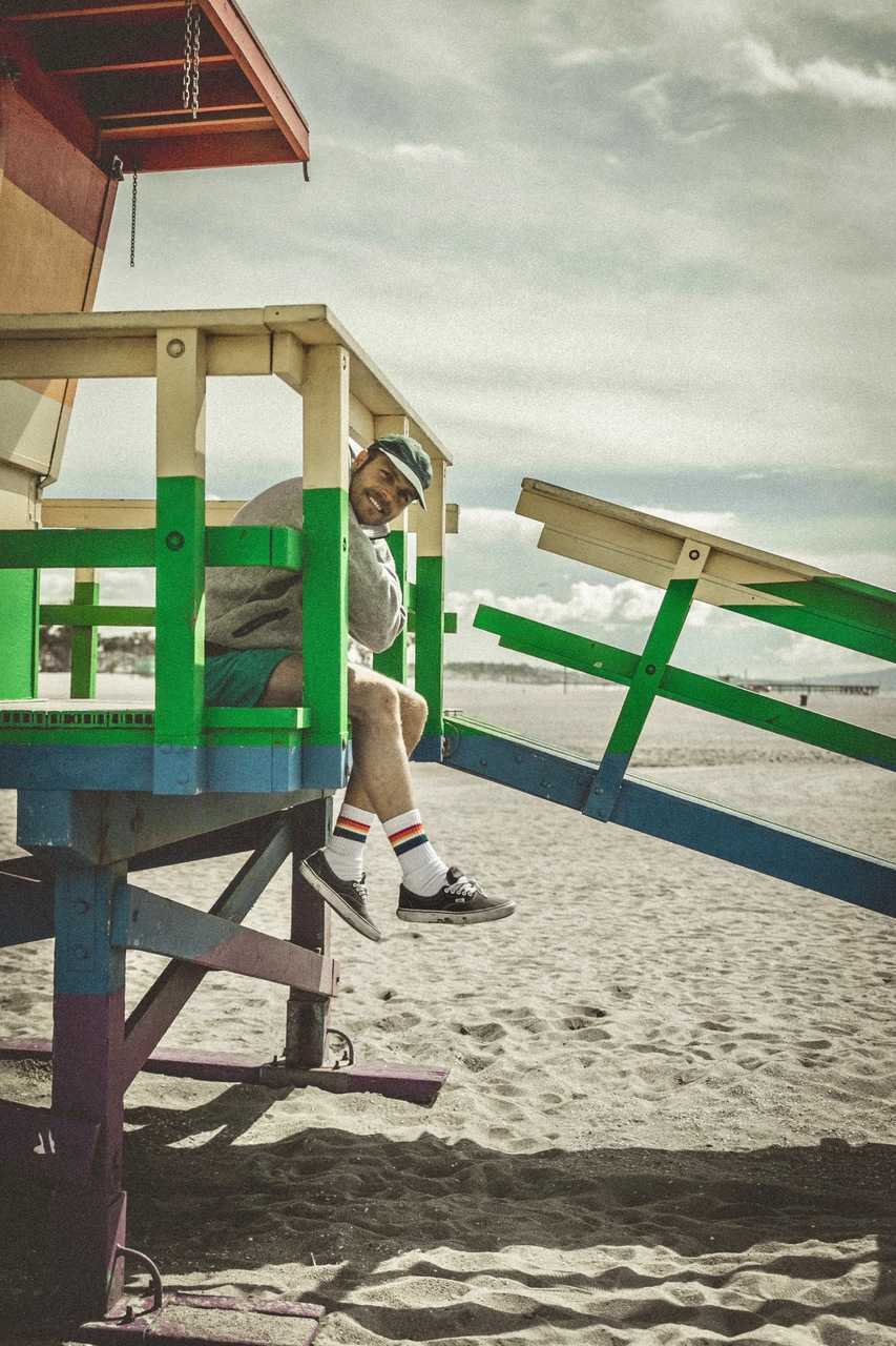 Knee-high retro socks for expressing non-binary pride in motion