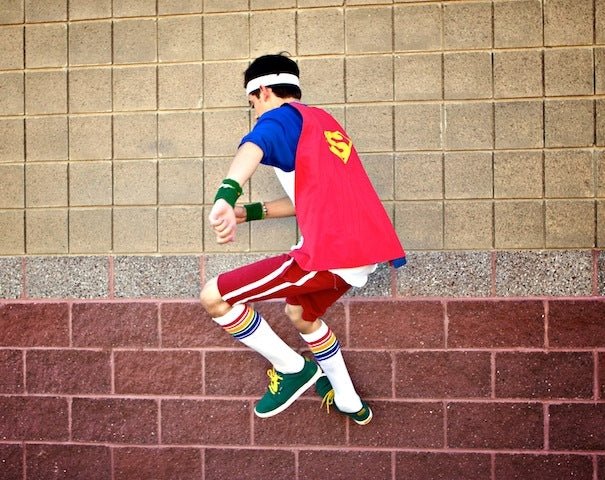 Fearless rainbow knee high socks styled with sneakers and streetwear
