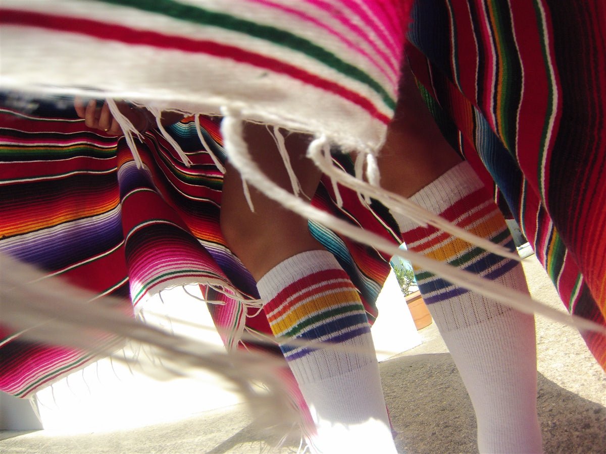 Fearless rainbow knee high tube socks with bold rainbow stripe design