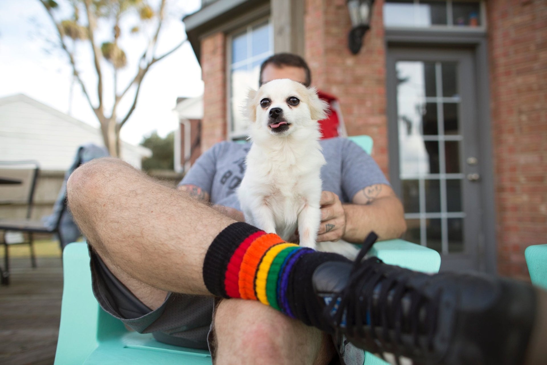 Close-up of Glow rainbow knee high tube socks by Pride Socks