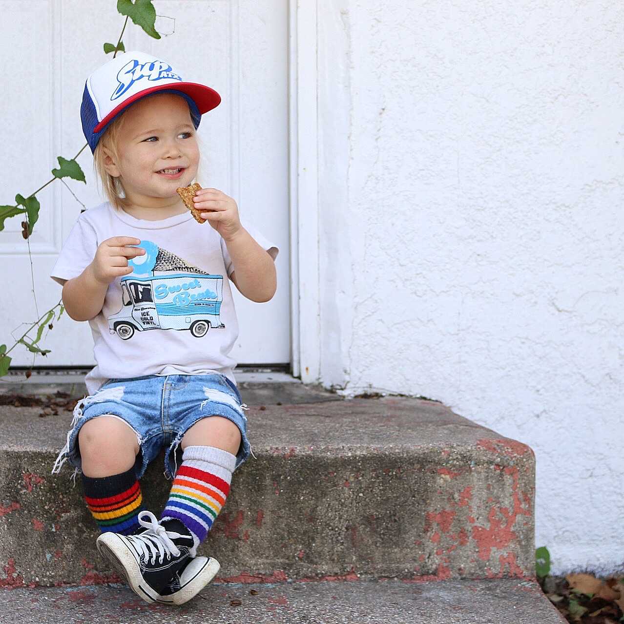 Playful toddler outfit featuring retro rainbow tube socks