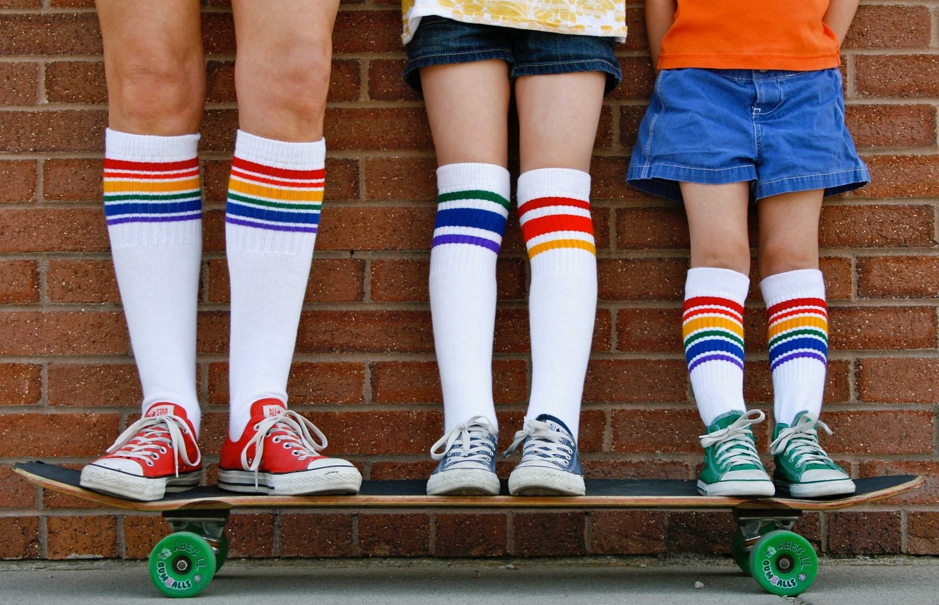 Close-up of Courage rainbow under the knee tube socks