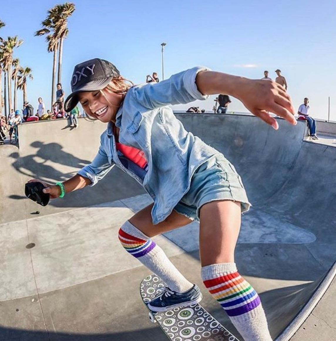 sky brown rocking out her pride socks while she rocks the bowl in venice beach, ca
