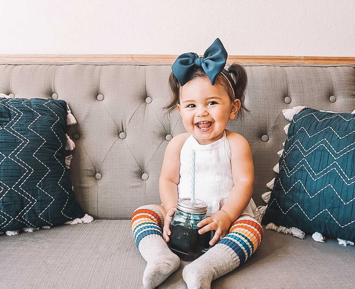 Retro rainbow tube socks worn by child with playful confidence