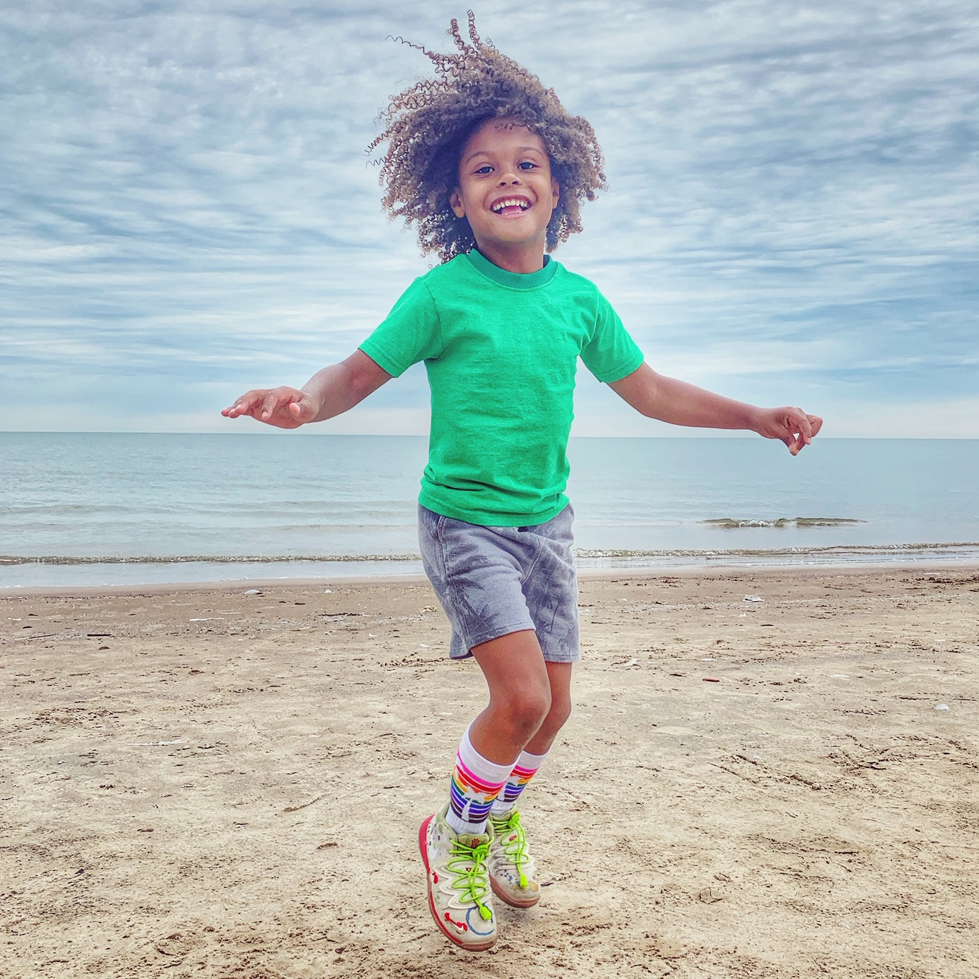 jeff rocking his jason collins pride socks while playing at the beach after playing basketball