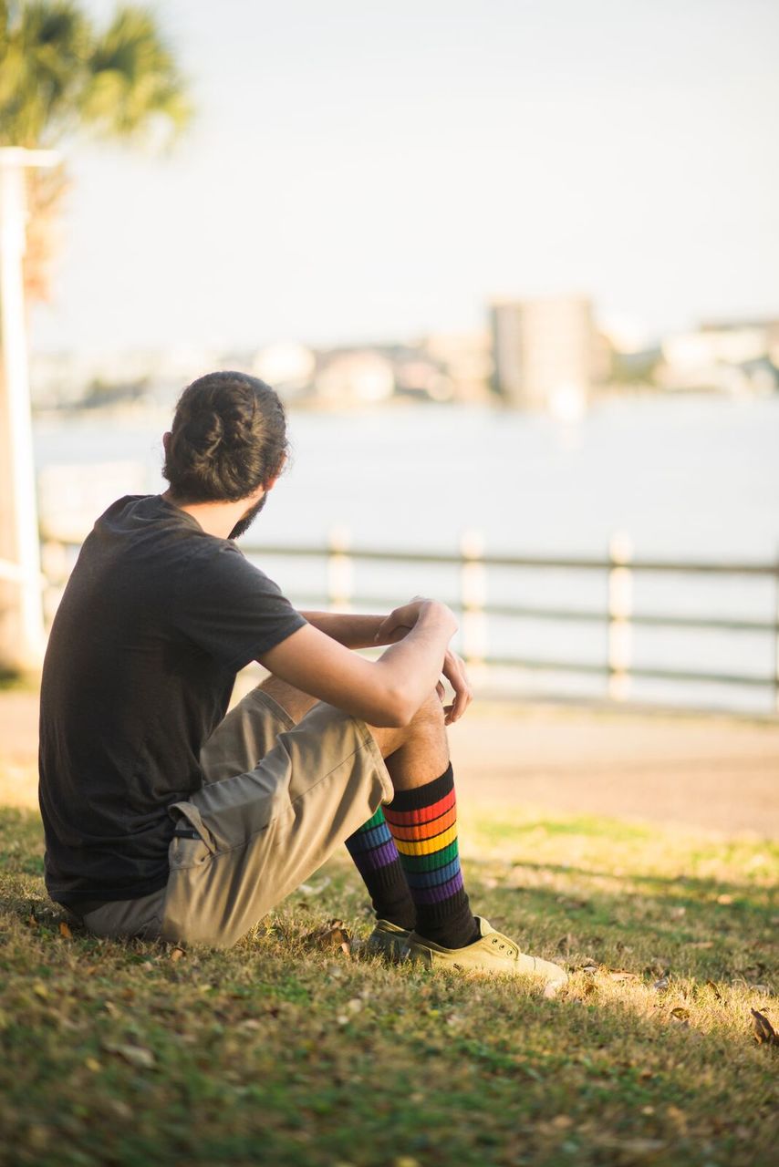Person wearing rainbow knee high tube socks from 6 pack collection