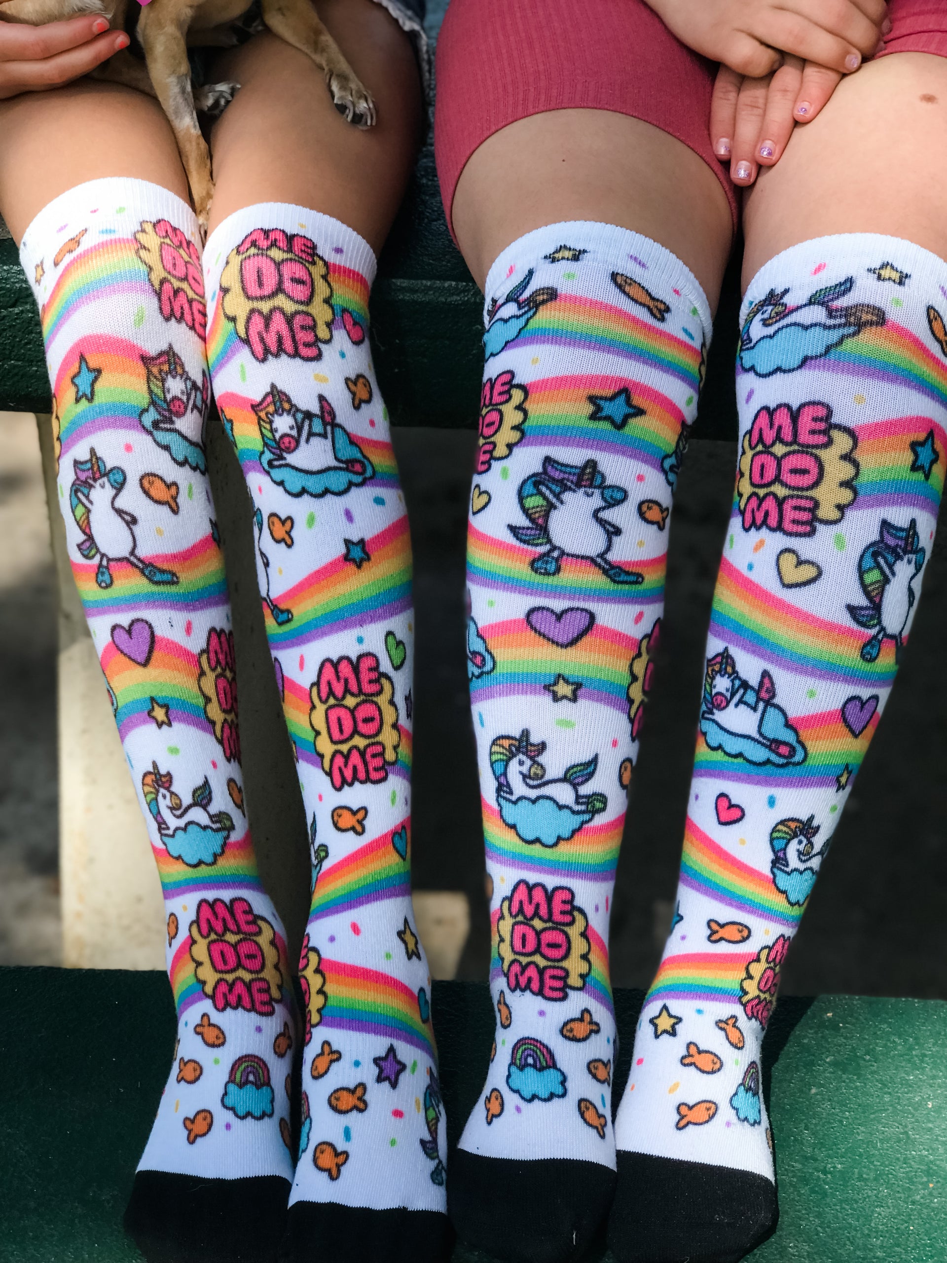 up close and personal of the rubys rainbow me do me pride socks.  make a difference with every step you take