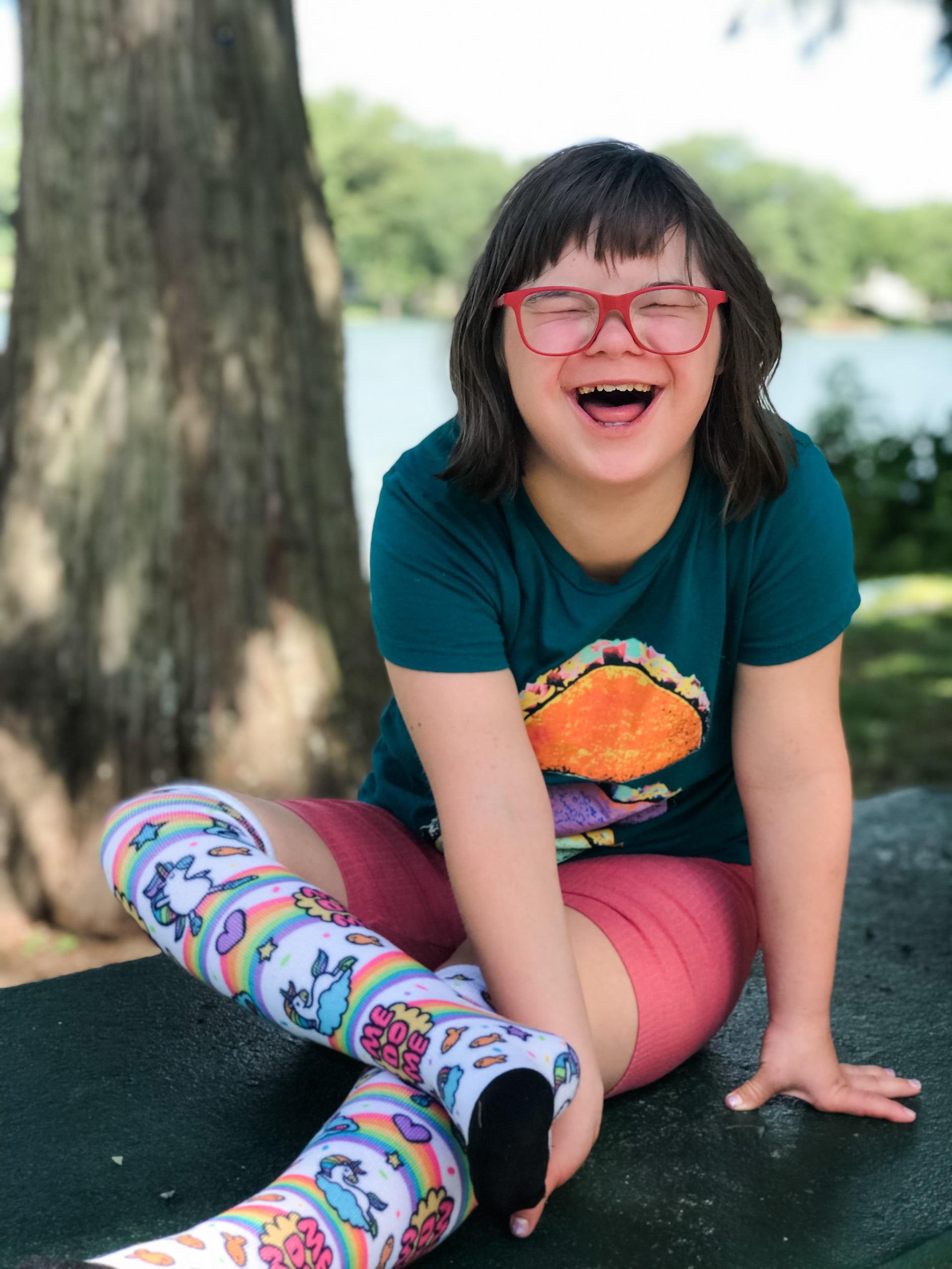 ruby rocking out her me do me pride socks- her smile is priceless