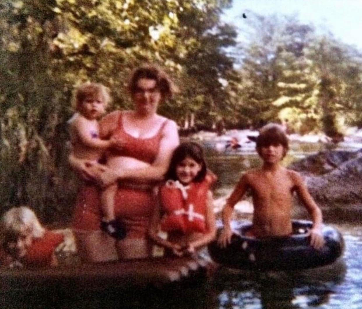playing in the water park with mom whose love has no boundaries with pride socks