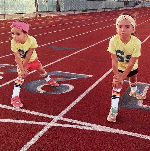 Fearless rainbow kids socks styled with sneakers while racing on the track