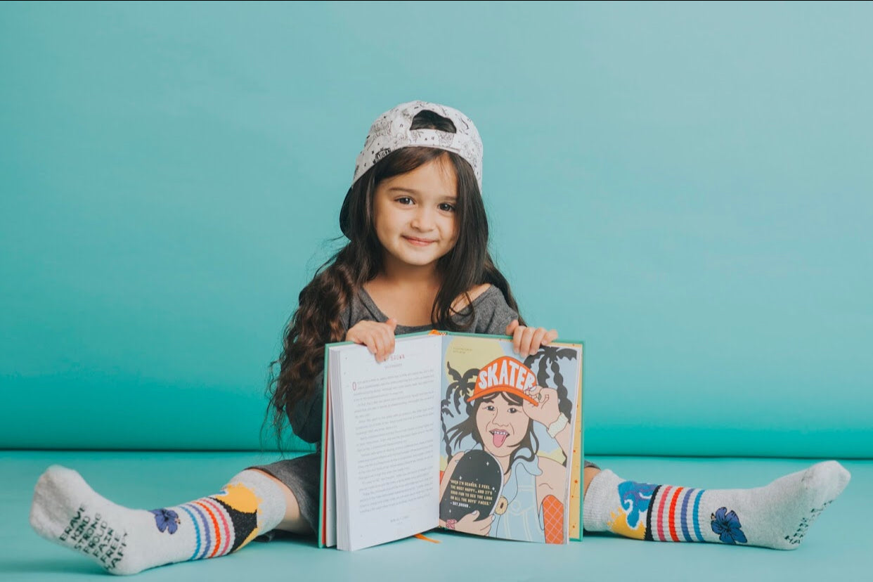 hello scout showing off her skys the limit socks with sky brown in the girls rebel book