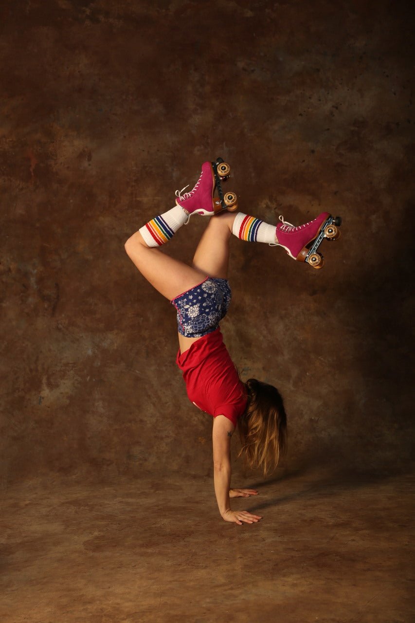 Person wearing Fearless rainbow knee high tube socks outdoors