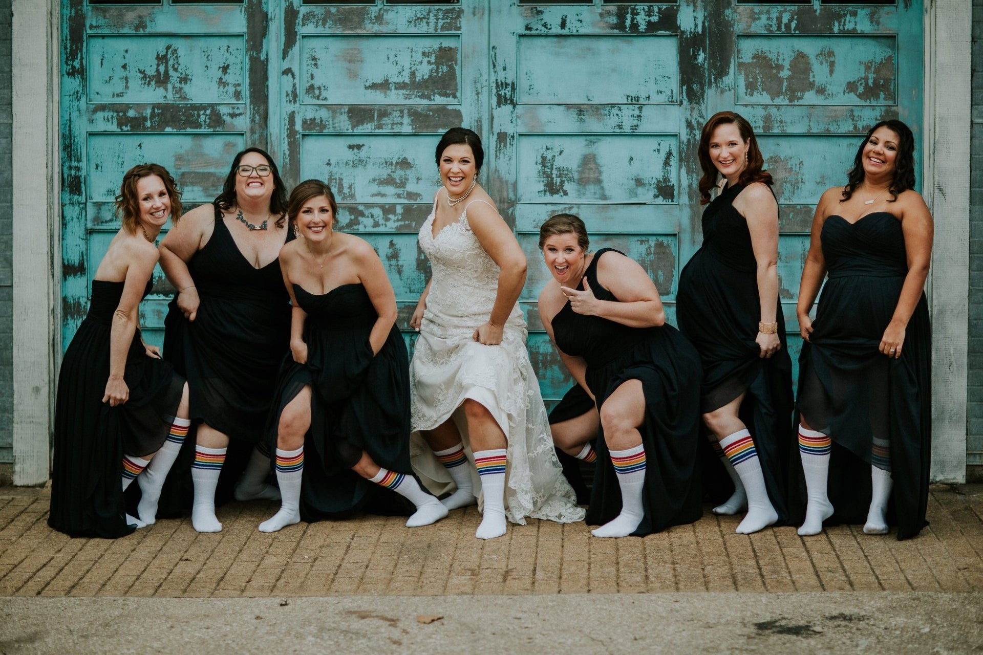 women wearing Fearless rainbow socks at wedding