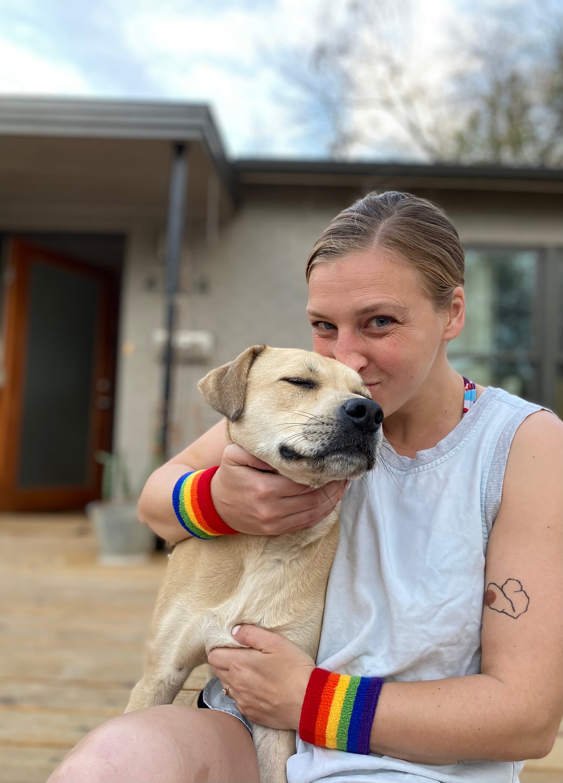 rainbow headband and wristbands in pride outfit with dog friends